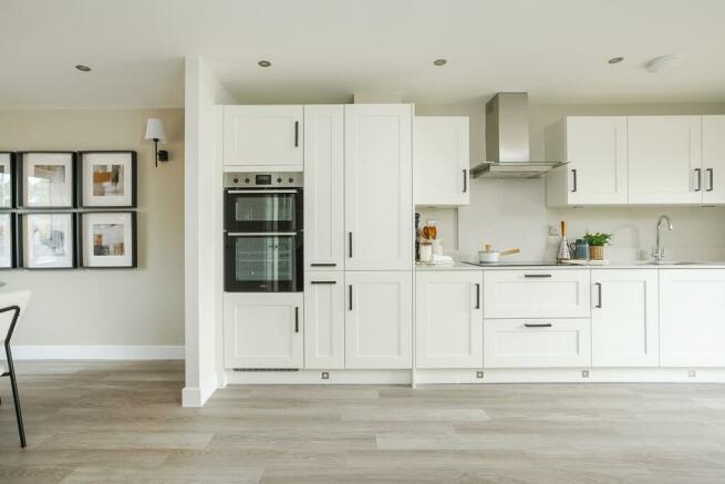The modern kitchen has ample storage and worktop space