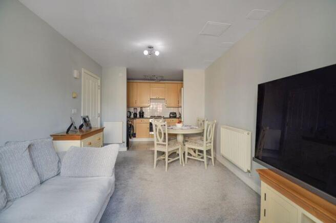 Living room opening to Kitchen