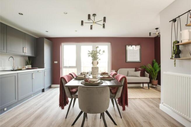An open-plan kitchen and dining area with modern appliances and ample dining space