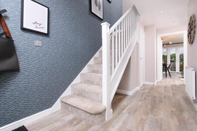 The Benford has a bright and spacious hallway with under stair storage
