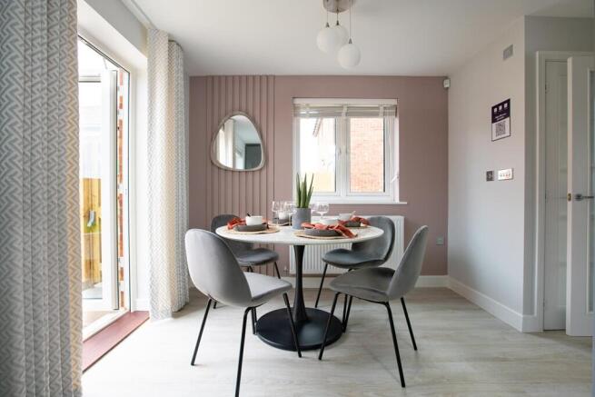 Double doors lead from the dining area to the garden
