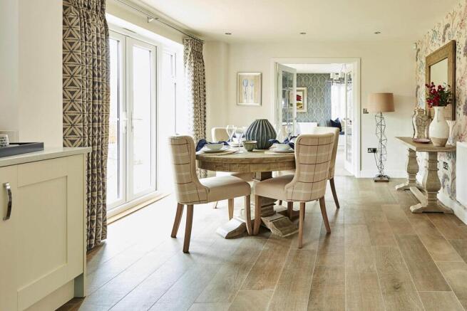Doors lead from the breakfast area to another reception room