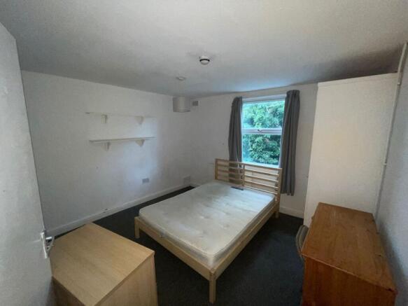 A spacious and bright double bedroom with ample...