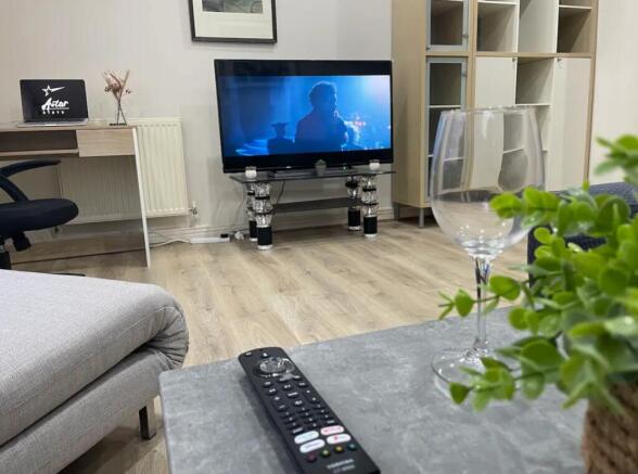 A spacious and inviting large modern living roo...