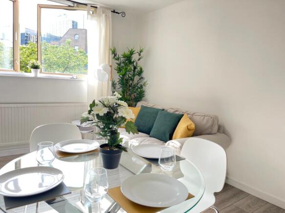 A bright and inviting large modern living room ...