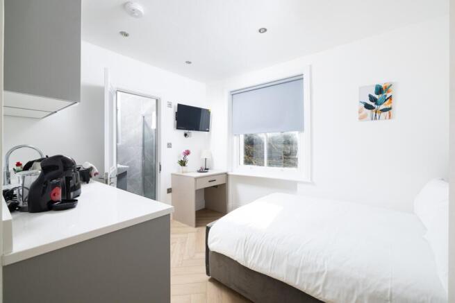 Bright and inviting double bedroom featuring a ...