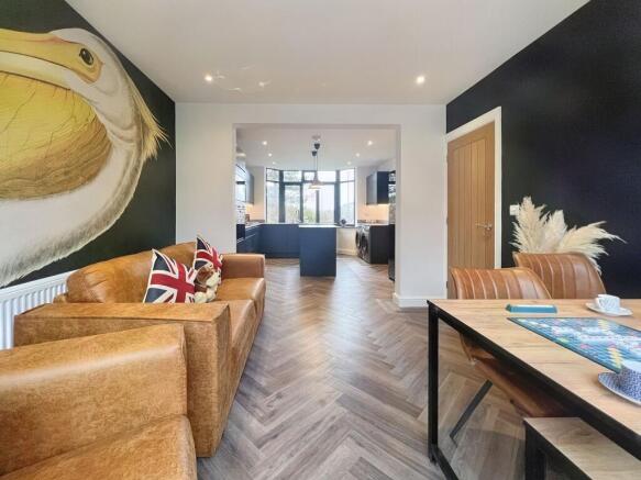 A stylish and modern living room featuring a wa...