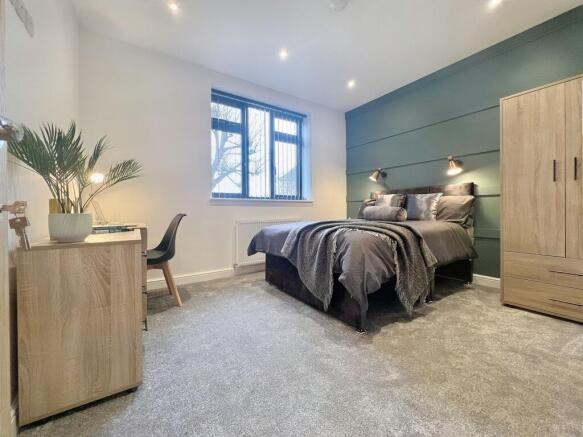 A stylish and well-maintained master bedroom fe...