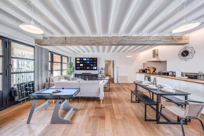 Experience a spacious and stylish living room, ...
