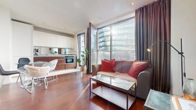 Bright and modern living room with floor-to-cei...