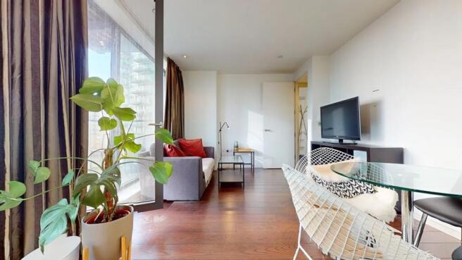 A modern and inviting living room featuring war...