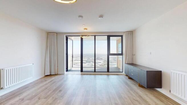 A spacious, modern living room with large floor...