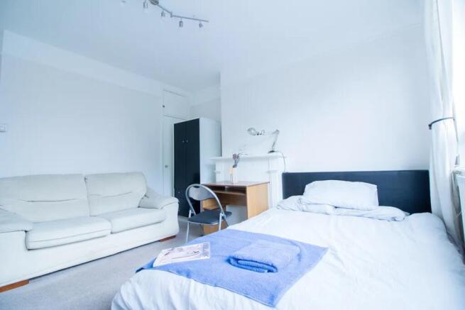 Bright and inviting double bedroom featuring a ...
