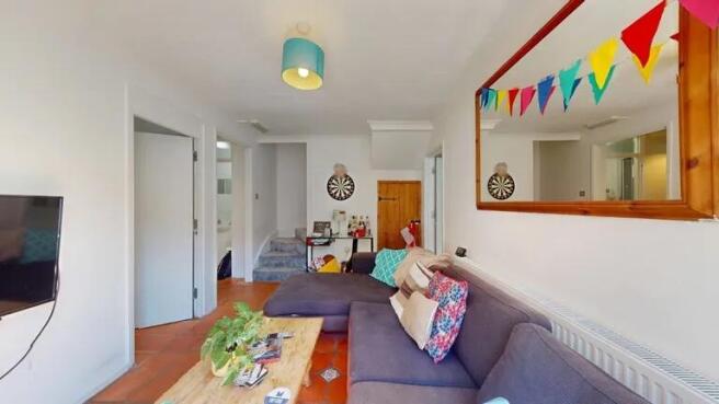 A cozy living room featuring a comfortable sect...