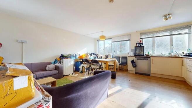 Bright and spacious living area with ample natu...