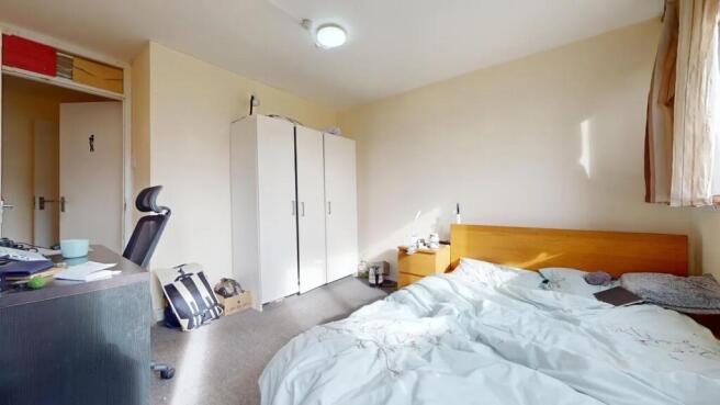 Bright and inviting double bedroom featuring a ...