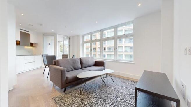 Bright and modern living room with large window...