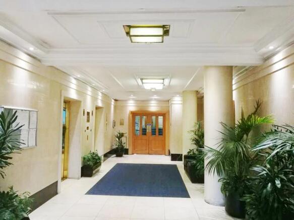 Bright and spacious reception area featuring el...