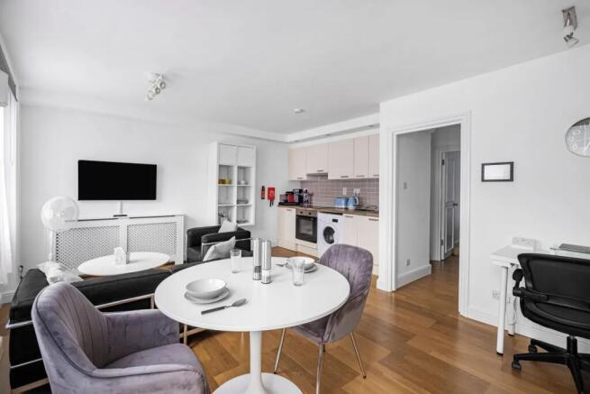 Bright and modern living space featuring a slee...