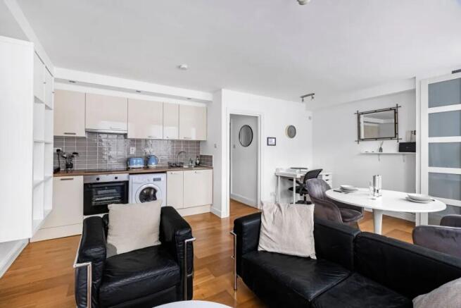 A modern and inviting open-plan living area fea...