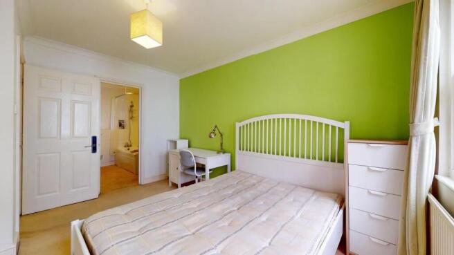 Bright and inviting master bedroom featuring a ...