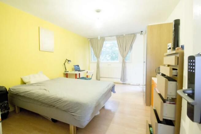 Bright and airy double bedroom featuring a comf...