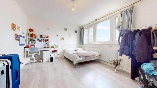A bright and airy double bedroom featuring a co...