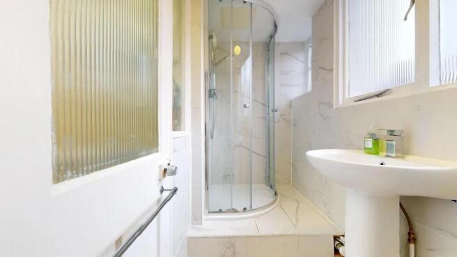 Bright and clean bathroom featuring a modern cu...