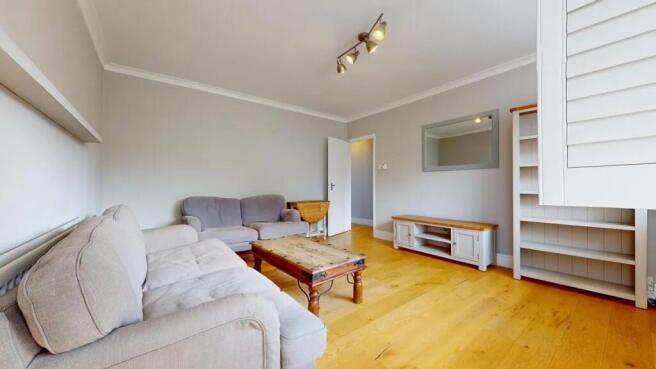 A cozy living room featuring comfortable sofas,...