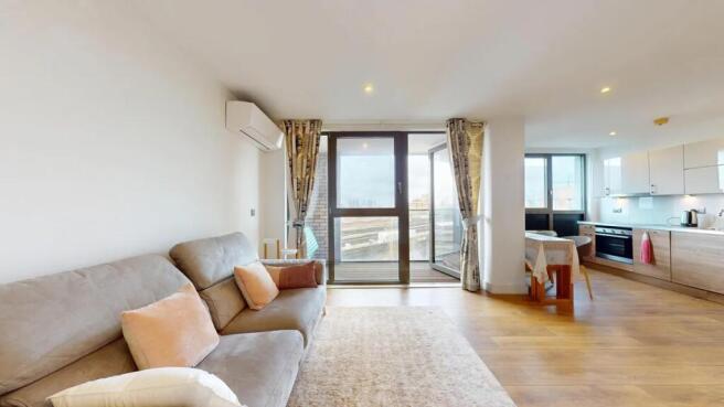 A bright and modern living room featuring a com...