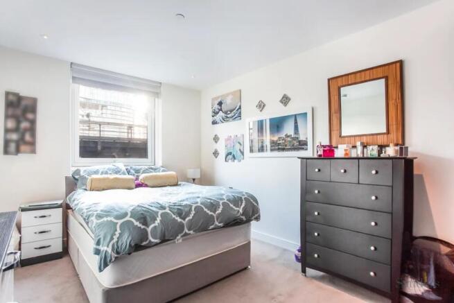 Bright and inviting master bedroom featuring a ...