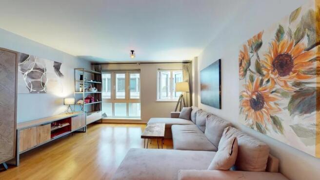 A bright and inviting living room featuring a l...