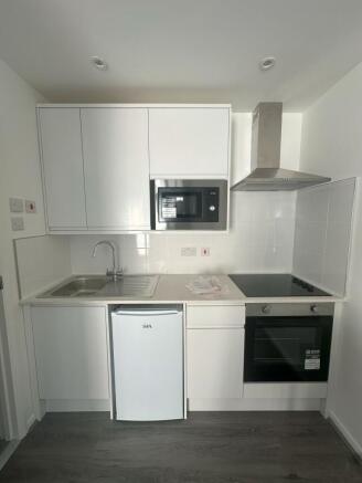 Bright and modern kitchen space featuring sleek...