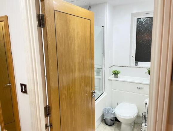 A well-maintained bathroom featuring modern fix...