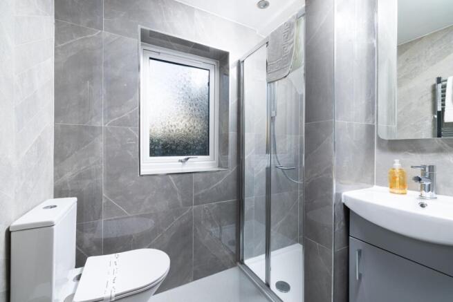 This modern bathroom features a sleek design wi...
