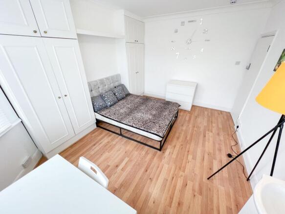 Bright and spacious master bedroom featuring a ...