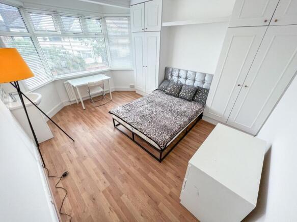 Bright and inviting double bedroom featuring a ...