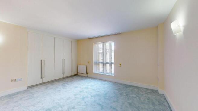 Bright and airy living room featuring a large w...