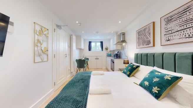 A bright and modern master bedroom featuring a ...