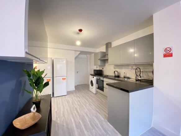 Modern, well-maintained kitchen with ample stor...