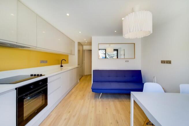 Bright and modern living room featuring a vibra...