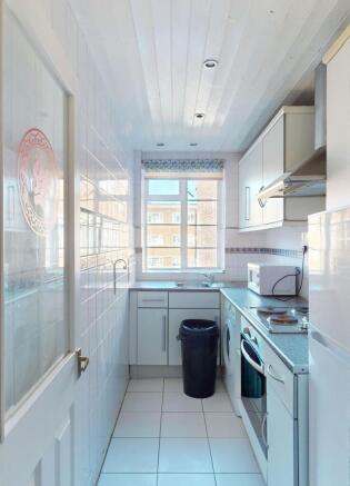 Bright and clean kitchen with ample natural lig...