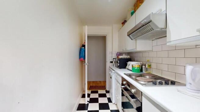 Bright and clean galley kitchen featuring moder...