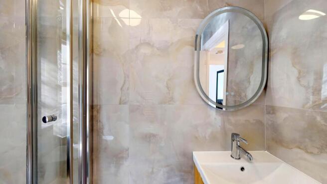 Modern bathroom featuring a sleek sink with a m...