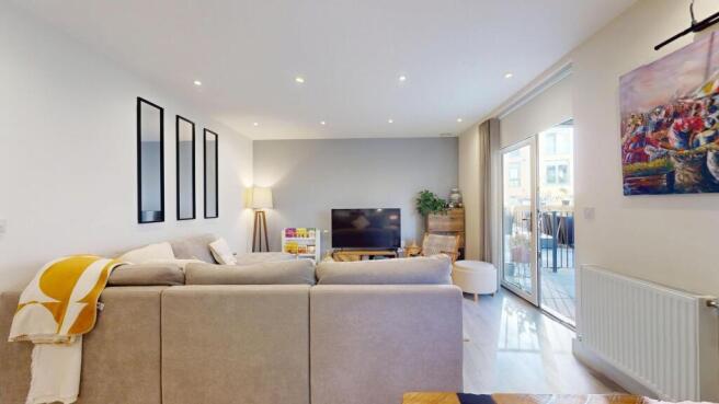 Bright and spacious living room with modern dec...