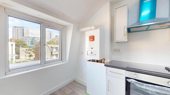 Bright and well-maintained kitchen with a large...