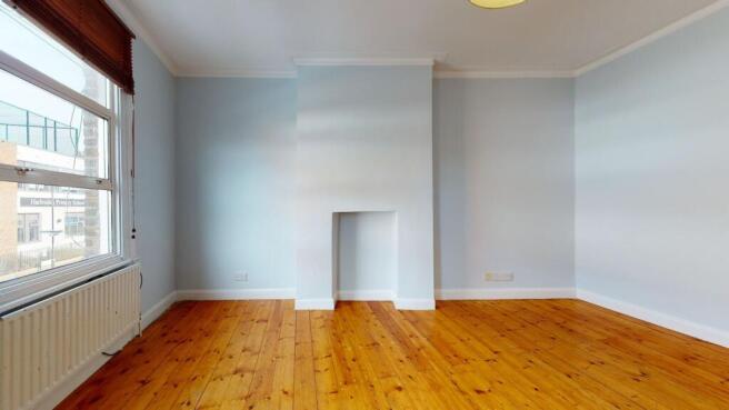 Bright and spacious bedroom featuring polished ...