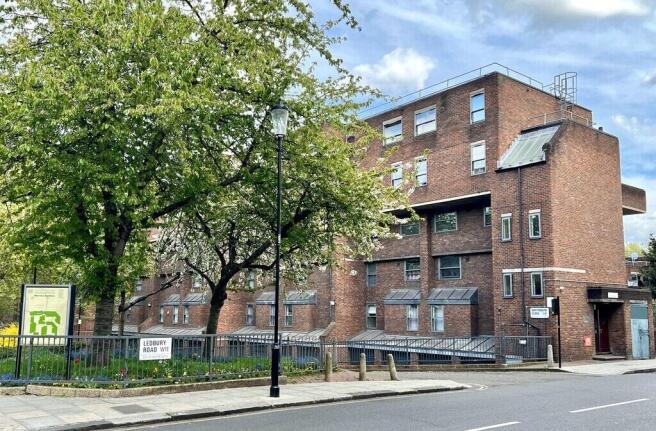 A charming brick residential building situated ...