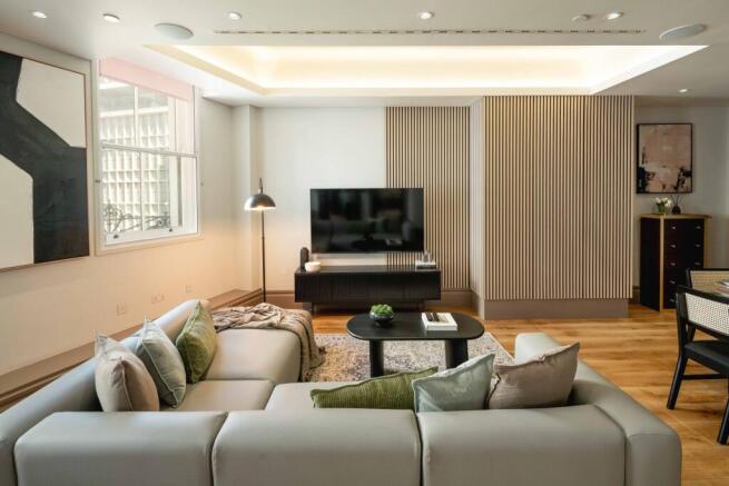 Contemporary living room with a large sectional...