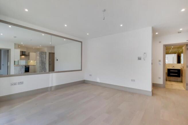 Bright, modern open-plan living space with ligh...